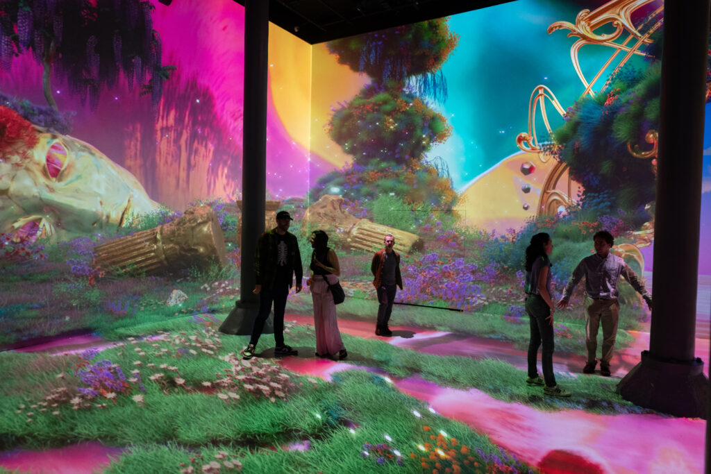 Immersive colorful room featuring couples exploring art in New York City